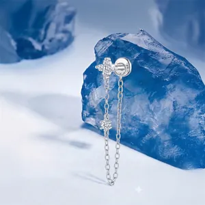 Macro view of S925 sterling silver four-leaf flower stud with moissanite tassel chain