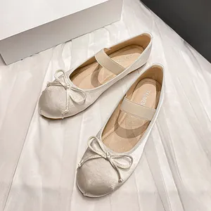 Elegant French vintage ballet flats with bow and elastic strap in pearl white finish