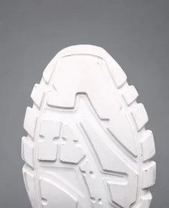 Macro detail of white anti-slip rubber outsole for men's lightweight sneakers