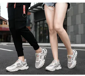 On-feet look of professional breathable white sneakers for men in an urban street setting