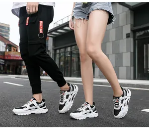 Lifestyle shot of breathable white and black chunky sneakers for men and women