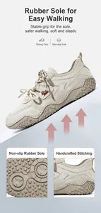 Detail view of beige leather outdoor shoe showing rubber sole and hand-stitched craft.