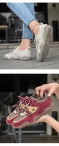 Detailed view of genuine leather outdoor sneakers in beige and wine red with anti-slip soles