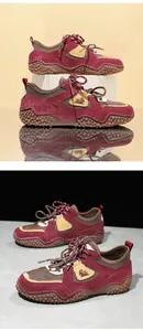 Detailed view of burgundy suede and mesh outdoor leisure sneakers with textured rubber soles.