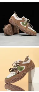 Detail shot of brown suede outdoor leisure shoes with unique nubby rubber soles.