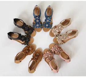 Detail view of bohemian wedge floral sandals in various colors arranged in a circle