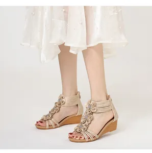 Detailed view of Bohemian wedge sandals featuring delicate 3D flower embellishments.