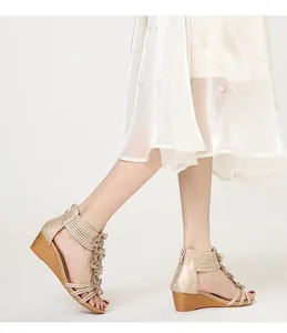 Side view detail of Bohemian wedge sandals with floral accents and multi-strap design
