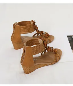 Bohemian brown wedge sandals with decorative flowers and back zipper closure