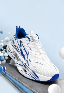 Breathable mesh running shoe with shock-absorbing popcorn sole and dial laces