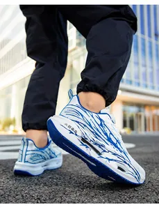 Close-up of breathable men's white and blue mesh running shoes with unique graphic print