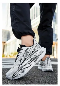 Side view of white and black patterned men's running shoes with BOA dial lacing system