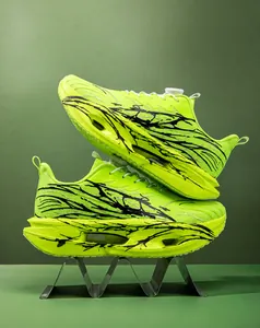 Side view of neon green mesh running shoes with hollowed shock-absorbing soles