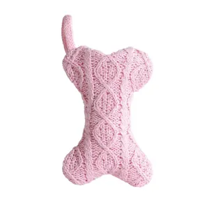 Cozy pink knitted bone-shaped Christmas stocking for pet gift bag and holiday decor