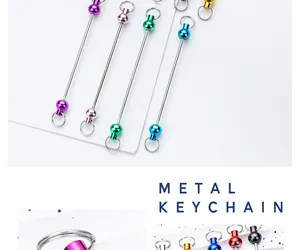 Detail view of colorful DIY metal beaded keychain rods in various metallic finishes