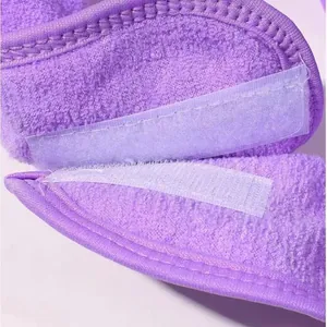 Macro view showing the sturdy velcro closure on the purple plush face wash headband