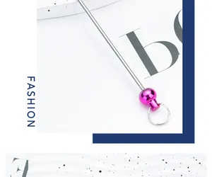 Macro detail showing a bright pink bead on a silver DIY beadable metal keychain rod