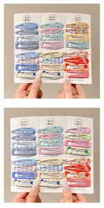 Set of colorful patterned children's BB hair clips on display cards