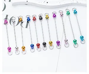 Macro view of vibrant colorful DIY beaded keychain rods with double loop ends and metallic finish