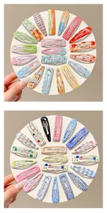 Detailed view of colorful patterned BB hair clips for girls arranged in a circle