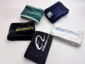 Detailed view of assorted soft microfiber headbands with various custom embroidered logos