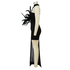 Side view detail of black off-shoulder sexy dress with feathers and mesh train