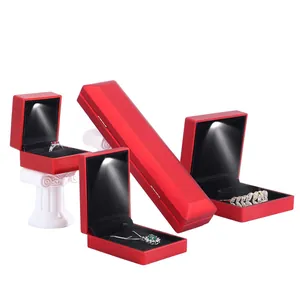 Elegant red LED jewelry boxes set for rings and necklaces with internal spotlights