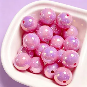 Macro view of 16mm pink UV plated acrylic beads for DIY jewelry making