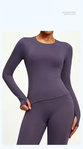 Detail of slim-fit purple long sleeve yoga top with thumb holes for exercise