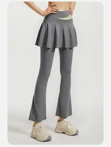 Detailed view of high waist color block flared yoga leggings with integrated pleated skirt