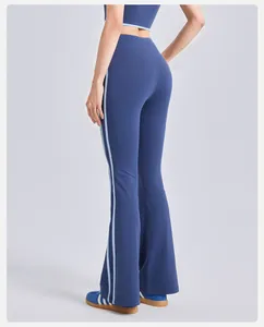 Back view detail of blue high-waisted flare yoga pants featuring side stripe accents