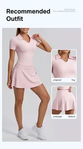 Two-piece pink athletic set featuring a slim-fit short-sleeved polo top and matching skirt.