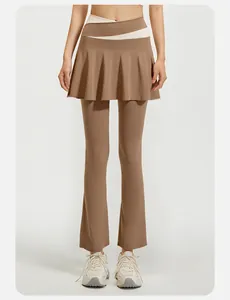 Model wearing high waist flared yoga leggings with a skirt overlay in mocha color