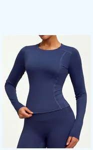 Close-up of navy blue slim-fit long-sleeve athletic yoga top on a female model