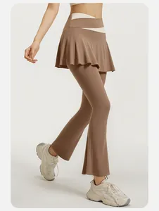 Detail view of high-waist flared yoga skort leggings in tan color with color-blocked waist.