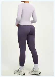 Rear view of a slim-fit lavender long-sleeve yoga top and purple leggings