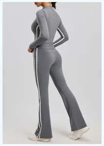 Detailed side and back view of a grey slim-fit long sleeve yoga set with white side stripes
