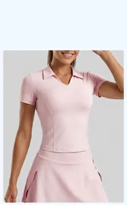 Close-up of slim-fit pink yoga polo shirt with matching sports skirt