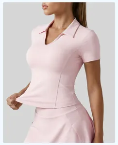 Detail view of a pink slim-fit sports yoga top featuring a lapel collar and V-neckline