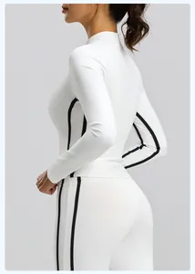 Side view of slim-fit white yoga jacket with black side stripes and stand collar