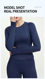 Detailed view of dark blue long-sleeve slim-fit yoga top with athletic stitching