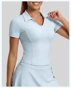 Close-up of light blue polo collar athletic top showing fabric texture and slim fit design.