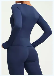 Back view of a navy blue slim-fit long-sleeved high-elastic athletic performance yoga top