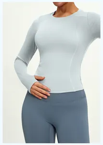 Detailed view of high-stretch slim fit long sleeve yoga top featuring ergonomic stitching