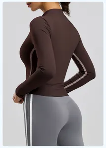 Back view of brown slim fit long sleeve yoga jacket with stand collar for winter workout