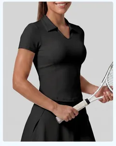 Close-up detail of women's black slim fit athletic polo shirt and matching skirt
