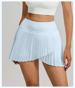 Close-up detail of light blue pleated sports skirt with asymmetric hem for women's fitness