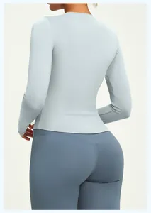 Back view of a premium slim-fit light blue long-sleeved yoga top for women's fitness