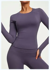 Detailed view of purple slim-fit yoga top with thumb holes and matching leggings