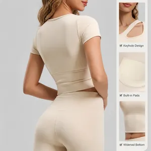 Asymmetric cut-out yoga short sleeve with fixed chest pads for high impact support